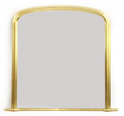 Lot 425 - A giltwood overmantel mirror of arched form
