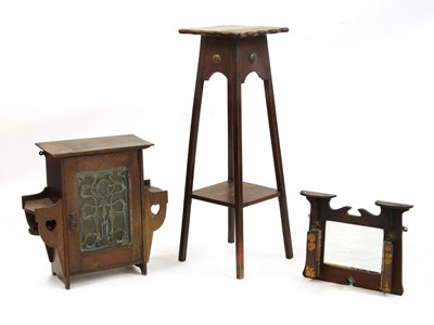 Lot 183 - An Arts and Crafts oak hanging smoker's cabinet
