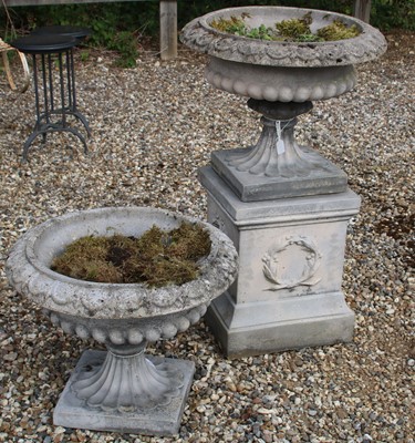 Lot 688 - A composite stone Capana urn on stand
