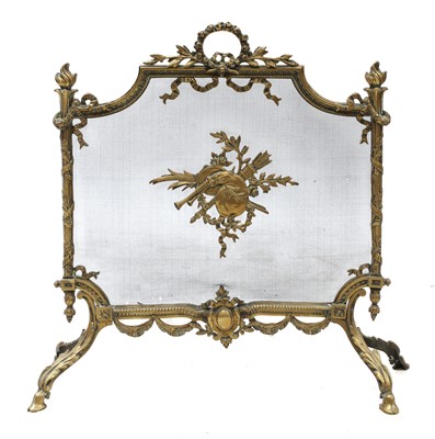 Lot 264 - A French Louis XV-style cast gilt brass fireguard