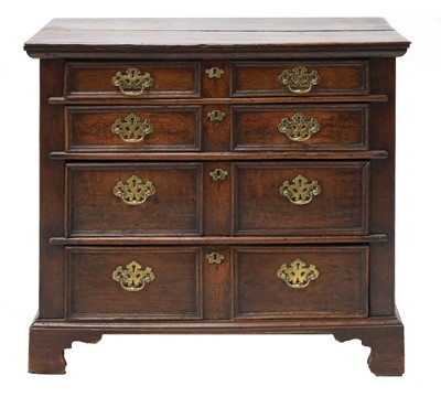 Lot 705 - A transitional oak chest of drawers
