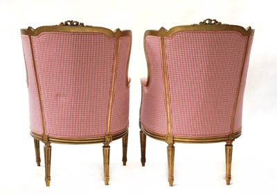 Lot 67 - A pair of French Louis XVI-style giltwood fauteuils