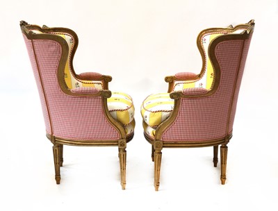 Lot 67 - A pair of French Louis XVI-style giltwood fauteuils