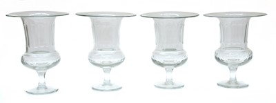 Lot 51 - A set of four glass celery vases