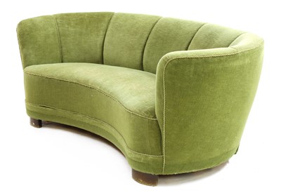 Lot 451 - A Danish green velour 'banana' settee