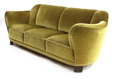 Lot 467 - A Danish green velour three-seater settee