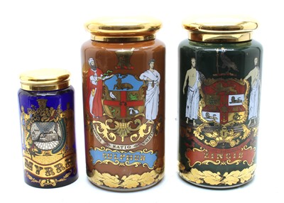 Lot 251 - Three reproduction glass chemist's Specie jars and covers