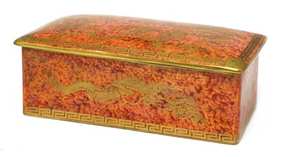Lot 375 - A Wedgwood 'Celestial Dragon' orange lustre cigarette box and cover