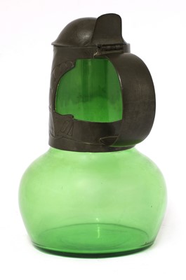 Lot 124 - A Tudric pewter and green glass claret jug and cover