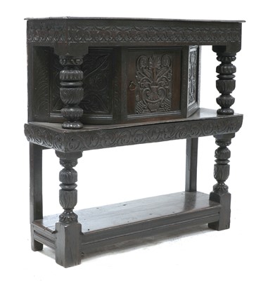 Lot 724 - A small oak livery cupboard
