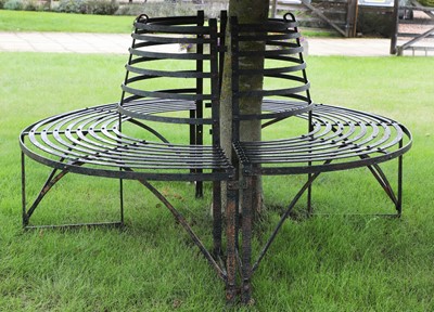 Lot 422 - A wrought iron tree seat