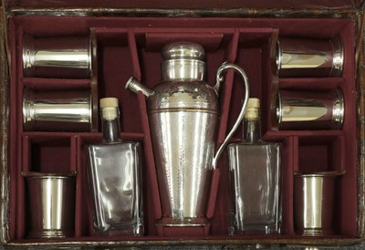 Lot 415 - A crocodile skin suitcase cocktail set