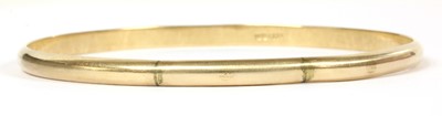 Lot 111 - A plain gold D section bangle