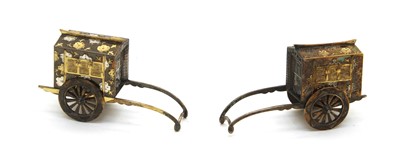 Lot 68 - A pair of Japanese sterling silver and silver gilt miniature rickshaws