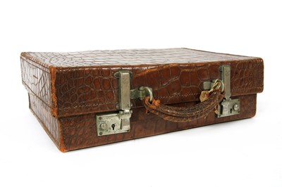 Lot 275 - An early 20th century crocodile skin overnight case