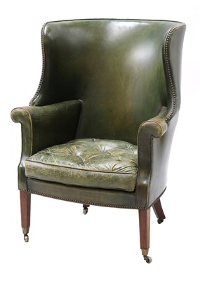 Lot 849 - A barrel back armchair