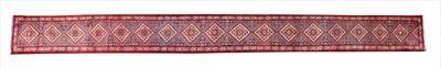 Lot 302 - A long North West Persian runner