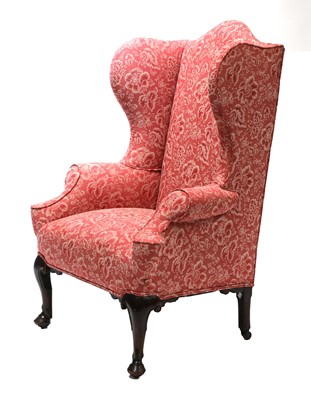 Lot 871 - A mahogany wingback armchair