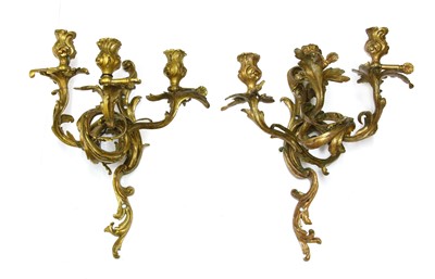 Lot 824 - A pair of Louis XV-style bronze three-branch wall lights