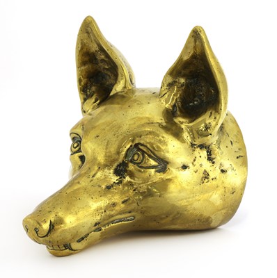 Lot 64 - A brass doorstop