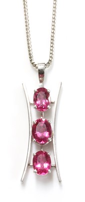 Lot 357 - An 18ct white gold three stone pink tourmaline pendant