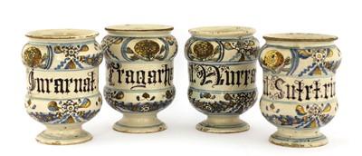Lot 379 - A set of four Italian majolica apothecary jars