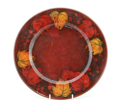 Lot 211 - A Moorcroft flambé 'Leaf and Berry' dish