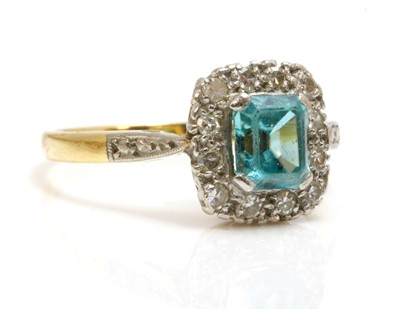 Lot 145 - A blue zircon and diamond rectangular cluster ring