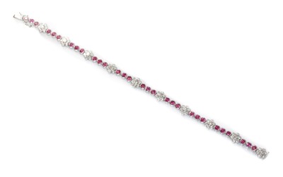 Lot 445 - A white gold sapphire and diamond line bracelet