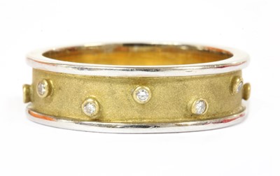 Lot 177 - An 18ct two colour gold diamond set band ring