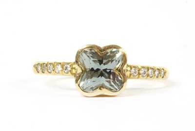 Lot 288 - An 18ct gold green sapphire and diamond ring