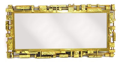 Lot 556 - A brutalist Syroco moulded mirror