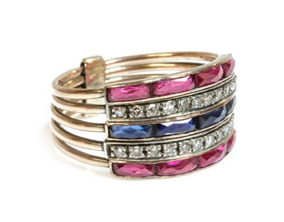 Lot 156 - An Art Deco-style five row synthetic sapphire, synthetic ruby and diamond harem ring, c.1950