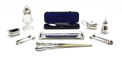 Lot 17 - A silver three piece cruet set on stand