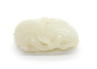 Lot 77 - A white jade group of two peaches