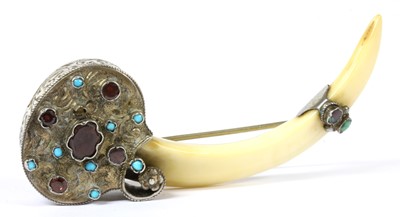 Lot 55 - A silver mounted tusk brooch