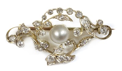 Lot 26 - A late Victorian pearl and diamond scrolling brooch