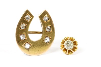 Lot 22 - A gold diamond horseshoe brooch