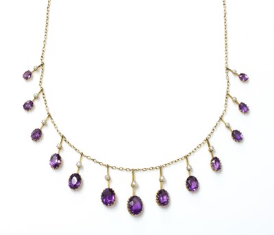 Lot 77 - An Edwardian amethyst and split pearl fringe necklace