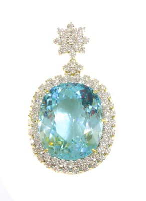 Lot 209 - An 18ct gold Paraiba tourmaline and diamond pendant