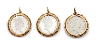 Lot 244 - Three Isle of Man one tenth platinum coin pendants or charms