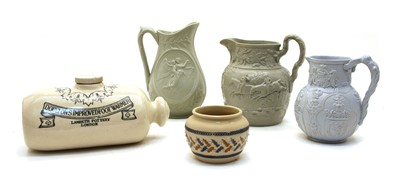 Lot 250 - A collection of seven VIctorian pottery relief-moulded jugs