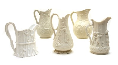 Lot 421 - A collection of five Victorian relief-moulded white stoneware jugs