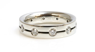 Lot 279 - A Swiss platinum, sapphire and diamond set band ring by Furrer-Jacot