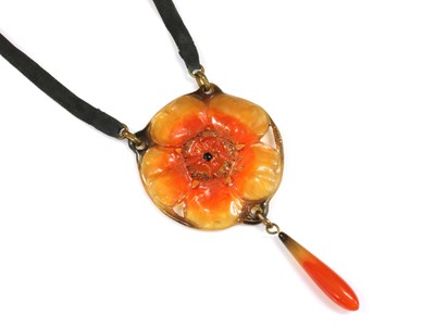 Lot 72 - A French Art Nouveau carved horn pendant, by George Pierre, c.1910