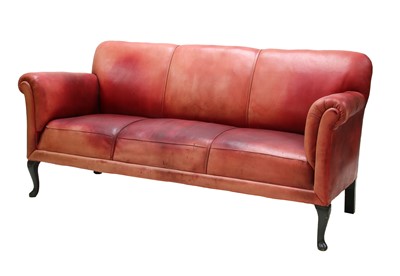 Lot 512 - A red leather three-seater settee