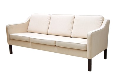 Lot 576 - A Danish cream fabric three-seater settee