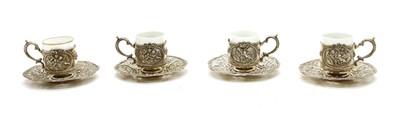 Lot 55 - A set of German silver coffee can holders and saucers