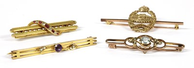 Lot 27 - A gold ruby and diamond bar brooch