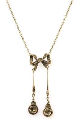 Lot 35 - A gold diamond négligée pendant